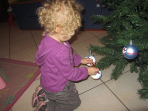 Michelle decorates the Christmas tree